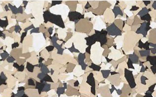 A close-up view of a surface with small, irregular beige, tan, black, and white paint chips.